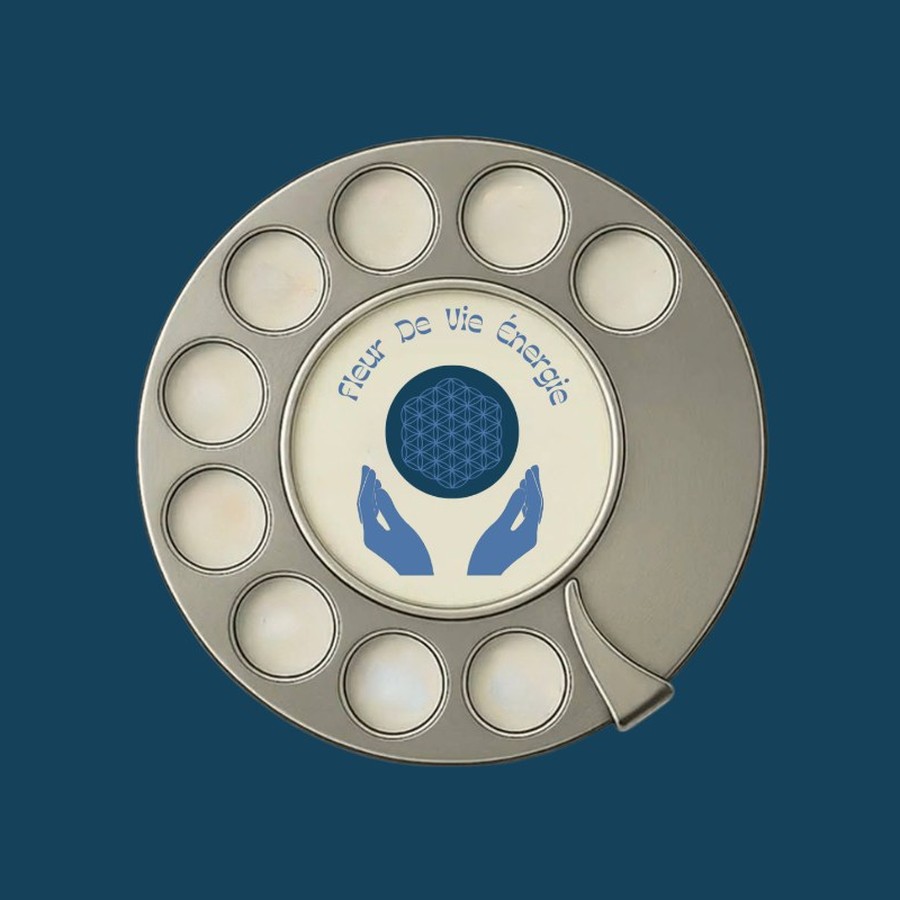 Logotipo Fleur de Vie Énergie sobre la esfera de un teléfono antiguo